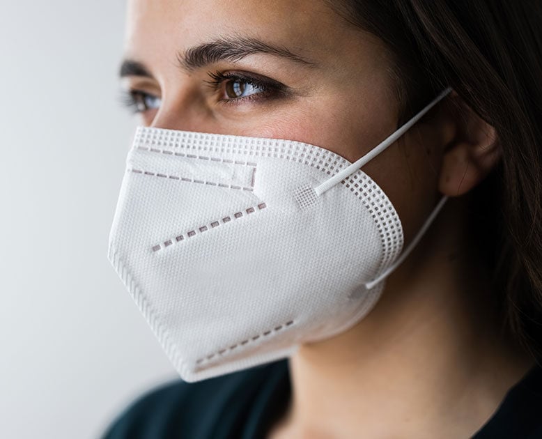 a female wearing N95 mask