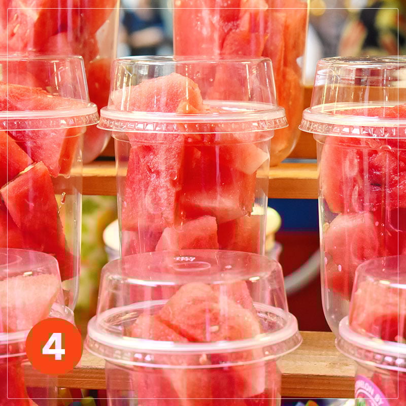 to go container with fresh fruits displayed at the school cafeteria