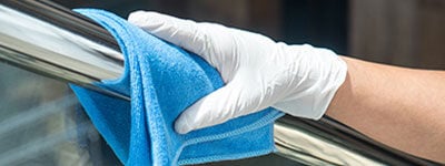 disinfecting railing with microfiber