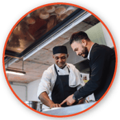 a consulant discussing restaurant improvement with a chef