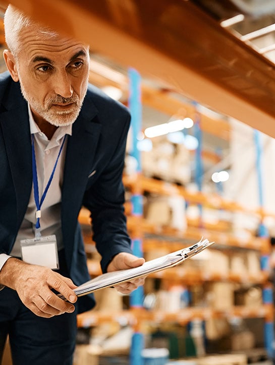 senior manager performing quality control in packaging