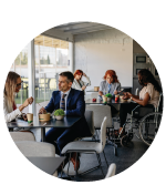 a clean break room full of employees using