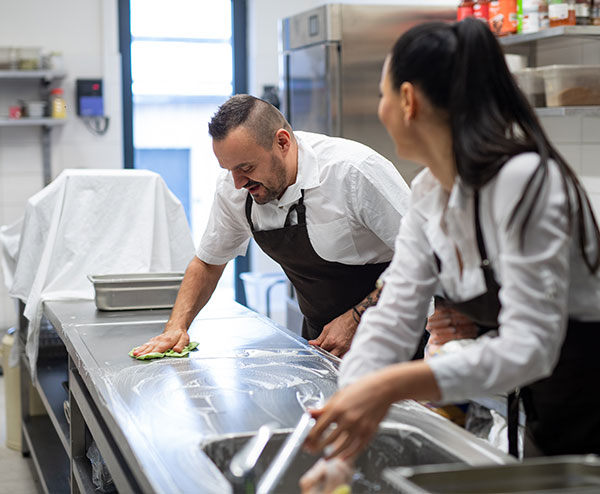 kitchen staff cleaning