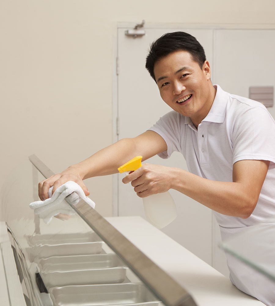 a cafeteria staff cleaning 