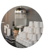 common area of breakroom with water stand and disposable cups