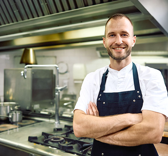 confident chef in his restaurant kitchen