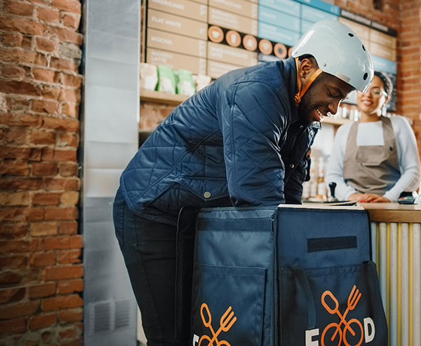 delivery guy with insulated food carrier