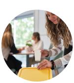employee recycling dispoables in breakroom