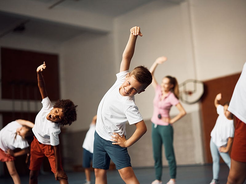 students exercising during PT at school-healthy students