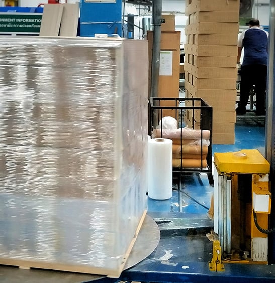 semi-automated stretch wrapping machine in action